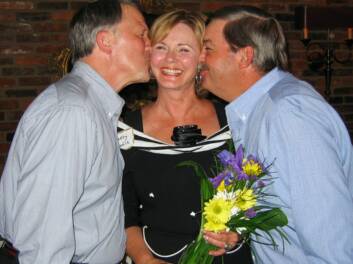 Somerville, Carey, and Raby kissing the homecoming queen