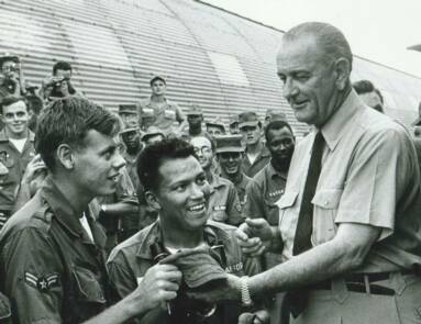 John Thompson at Cam Ranh Bay, Vietnam, 1966  discussing progress of the war